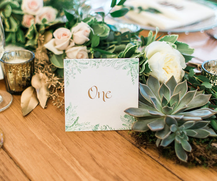 Flourishing greens table number Rachel Halsey Photography