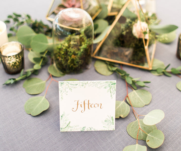 Flourishing greens table number Rachel Halsey Photography