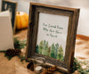 IN loving memory sign for a wedding pine trees