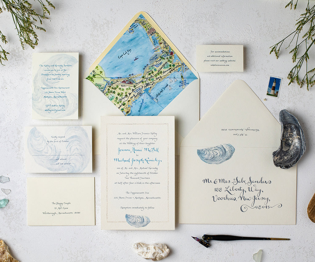 oyster with sand border wedding invitation